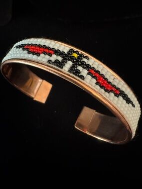 Hand Beaded Copper Cuff  bracelet w/Red & Black bird Design could be unisex